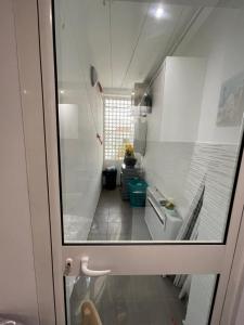 a view of a small kitchen from a door at La perle bleue de Sarah in Kheredine +41 photos