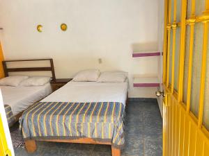 Un ou plusieurs lits dans un hébergement de l'établissement Amanecer