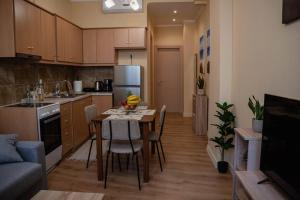 a kitchen with a table and chairs in a room at Corfu Town Cozy Apartment in Ágios Rókkos +20 photos