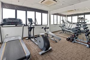 a gym with treadmills and exercise equipment in a building at 22Land Residence Hotel & Spa Ha Noi in Hanoi