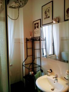 a bathroom with a sink and a mirror at All My Home in Villa San Giovanni