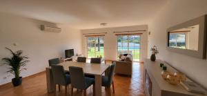 a living room with a dining room table and chairs at Atalaia Haven in Lagos