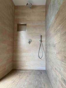 a bathroom with a shower in a wall at Ferienwohnung Sanddornidylle in Graal-Müritz