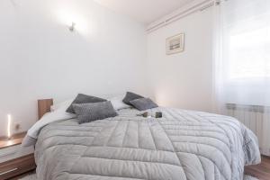 Posteľ alebo postele v izbe v ubytovaní Apartman Lana Vidikovac
