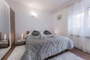 Posteľ alebo postele v izbe v ubytovaní Apartman Lana Vidikovac