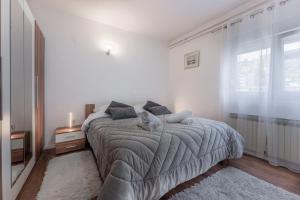 Posteľ alebo postele v izbe v ubytovaní Apartman Lana Vidikovac