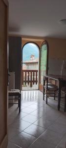 a room with a ping pong table and a window at CASA SAN MICHELE in Bovegno