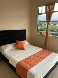 Postel nebo postele na pokoji v ubytování Hotel el Turista