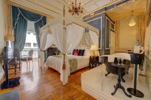 a bedroom with a bed and a sink in it at Palacio das Especiarias in Lisbon