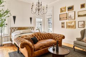 a living room with a couch and a bed at Blind Tiger Burlington in Burlington