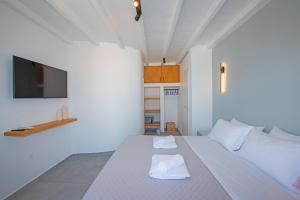 Postel nebo postele na pokoji v ubytování Villa Orion Mykonos - Blue Views Mykonos Villas + 37 fotografií