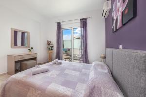 Postel nebo postele na pokoji v ubytování Kiriakos Apartment