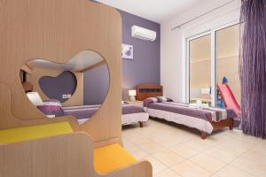Postel nebo postele na pokoji v ubytování Kiriakos Apartment