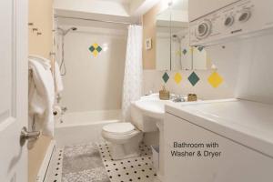 a bathroom with a white toilet and a sink at the Lanai, Best Area, 2 Bedrooms, WD, Large Balcony, Condo, 825sf in Tacoma