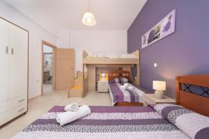 Postel nebo postele na pokoji v ubytování Kiriakos Apartment + 22 fotografií