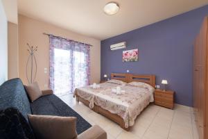Postel nebo postele na pokoji v ubytování Kiriakos Apartment