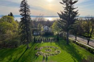 an aerial view of a garden with a clock in the grass at Blind Tiger Burlington in Burlington