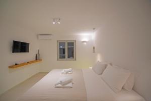 Postel nebo postele na pokoji v ubytování Villa Orion Mykonos - Blue Views Mykonos Villas