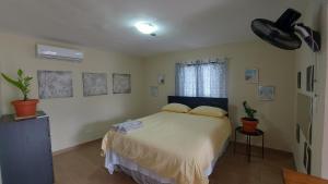 Postel nebo postele na pokoji v ubytování Casa Kamanda, Zona Colonial, Santo Domingo