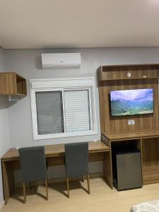 a dining room with a table and a window at Hotel Westphal in Pelotas