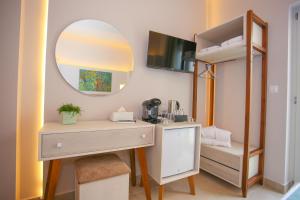 a room with a desk and a mirror and a bunk bed at Casa De Potie in Chania Town