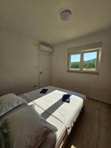 a bedroom with a large bed with a window at Green paradise in Marina