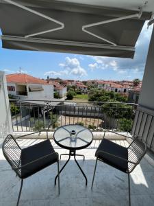 A balcony or terrace at Mageiras Boutique Hotel