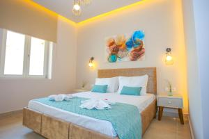 a bedroom with a bed with towels on it at Casa De Potie in Chania Town