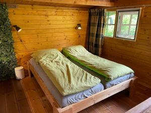 Ein Bett oder Betten in einem Zimmer der Unterkunft d'Alde Pastorije