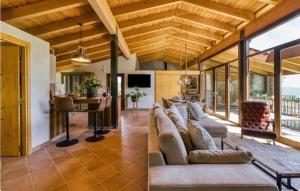 a living room with a couch and a table at Arc de can Puig Luxury Holiday Home in catalonia in Sant Ferriol