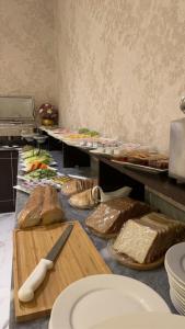 a kitchen with a bunch of food on a counter at فندق الوتين ALwateen Hotel in Al-ʿUla