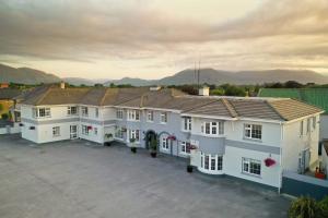 an aerial view of a large white house at The Lodges at Castle Lodge in Killarney