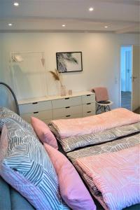 En eller flere senge i et værelse på Herz-Oase
