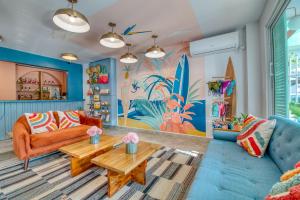 a living room with a couch and a table at Bocas Paradise Hotel in Bocas del Toro