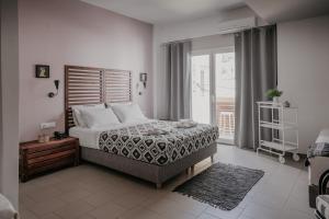 Ένα ή περισσότερα κρεβάτια σε δωμάτιο στο Tellus City