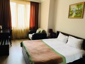 Postel nebo postele na pokoji v ubytování Hotel Brighton