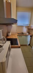 a kitchen with a sink and a counter top at ‘Good Feelings’ in Siófok