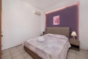 Posteľ alebo postele v izbe v ubytovaní Iliana Apartment