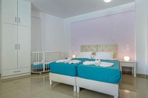 Postel nebo postele na pokoji v ubytování Palapart Gikas Gouvia