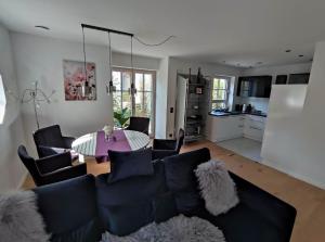 a living room with a couch and a table at Villa Florentina in Bad Wörishofen