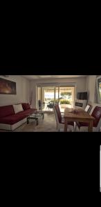 a living room with a couch and a table at Apartmani Kate in Klek