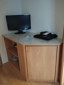 a desk with a television on top of it at Camping Mayer in Cavallino-Treporti