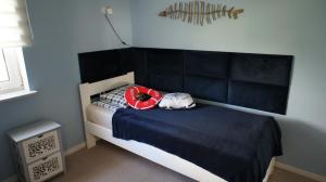 Postel nebo postele na pokoji v ubytování Apartament Gruba Ryba