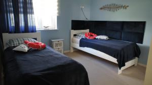 Postel nebo postele na pokoji v ubytování Apartament Gruba Ryba