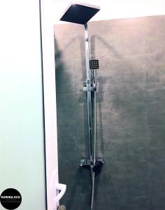 a shower in a bathroom with a glass door at Eureka Eco in Hue