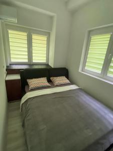 Postel nebo postele na pokoji v ubytování Apartman Oki Doki 1