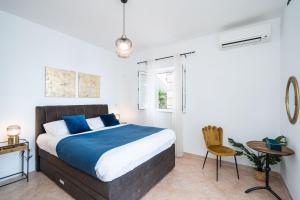 Postel nebo postele na pokoji v ubytování Villa Luce Dubrovnik