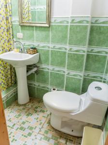 a bathroom with a toilet and a sink at Atitlan´s House in Panajachel