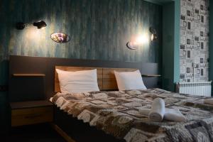 Postel nebo postele na pokoji v ubytování Family Hotel Gotse Delchev