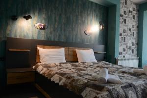 Postel nebo postele na pokoji v ubytování Family Hotel Gotse Delchev